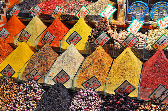 Small business storefront with pyramids of spices